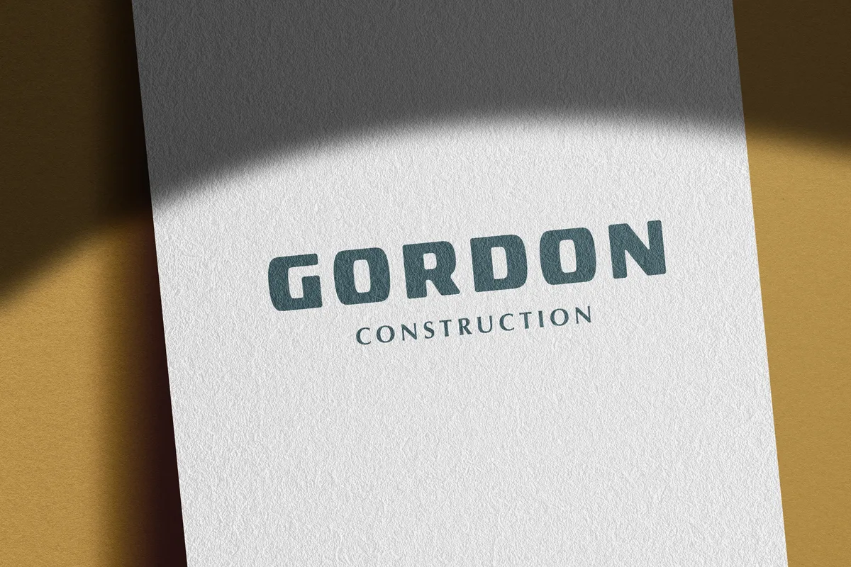 Gordon Construction logo on textured brand material