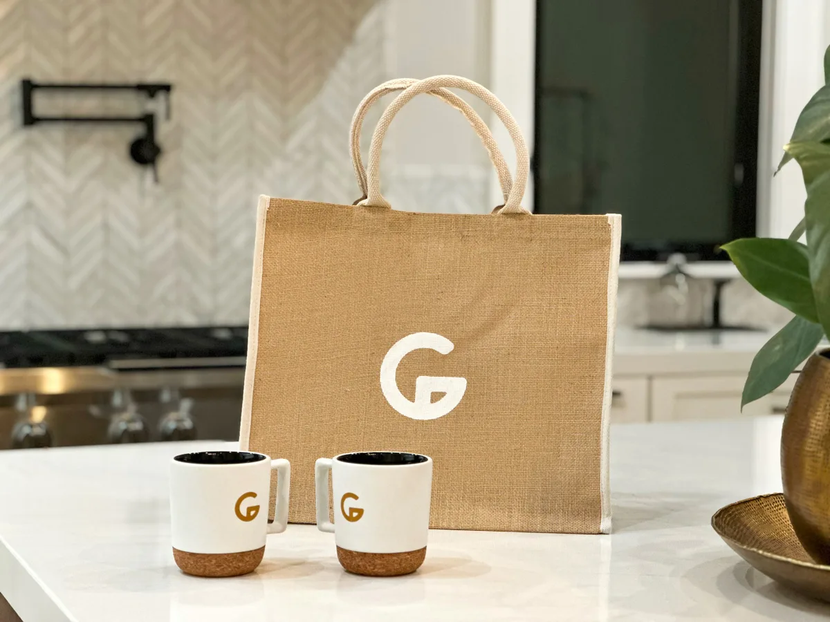 Gordon Construction branded tote and mugs in a remodeled kitchen